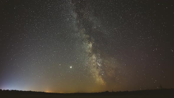 Night Starry Sky With Glowing Stars, Bright Glow Of Planets Saturn and Jupiter In Sky