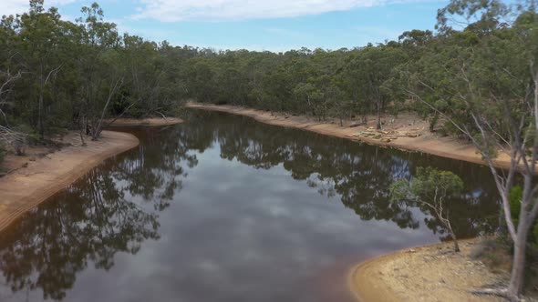 Aerial footage of a drought affected agricultural water reservoir in regional Australia