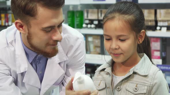 A Young Customer Chooses Which Item To Buy with the Help of an Apothecary