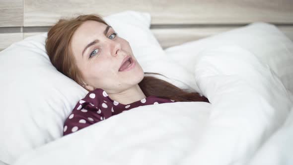 Beautiful Woman is Sad in Bed at Home Herself on Selfisolation During Quarantine