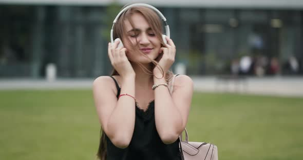 Girl Listening to Music with Headphones