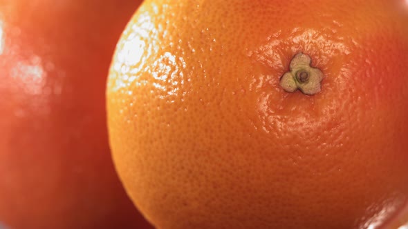 Rolling Half of Fresh Grapefruit and Opening the Inside of the Fruit in Slow Motion