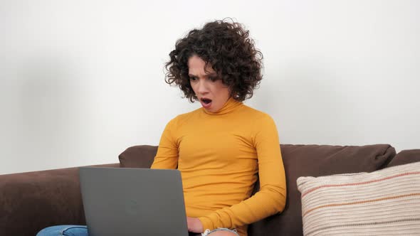 Shocked Businesswoman Works for Computer Looks at Laptop Screen Worried Problem