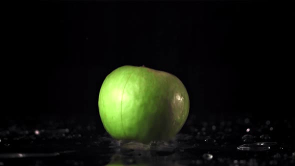 Super Slow Motion Apple Falls on the Table and Splits Into Two Halves