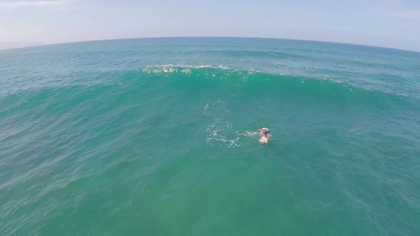 Aerial view of a wipeout sup stand-up paddleboard surfing in Hawaii.