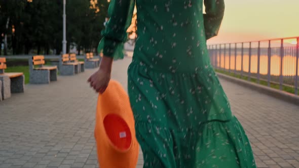 Portrait of Woman Pretty Caucasian Woman with Long Hair Smiling in the City at Sunrise