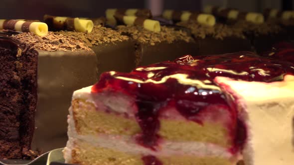 Closeup on Various Slices of Cakes on Display in a Store