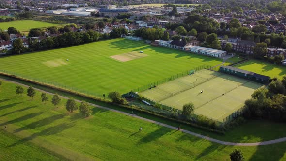 Aerial shot of Canons Park in London with cricket pitch and tennis court