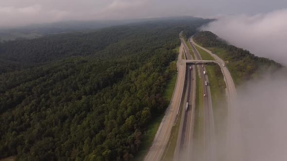 Vehicles Driving At I-75 And Rarity Mountain Road By Lush Mountains Of Newcomb, Tennessee On A Foggy