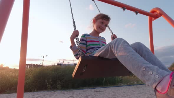 Girl Outdoors On Swing