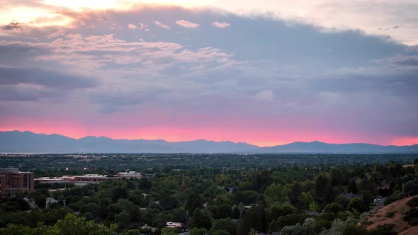 Time lapse of colorful sunset lighting up the horizon over Utah Valley