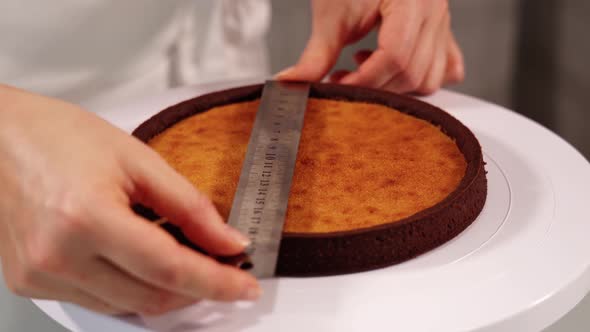 Confectioner Measures Tart Foundation with Metal Ruler