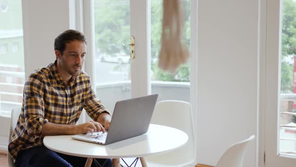 Millennial male professional working in a creative office