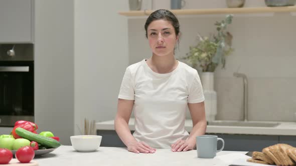 Young Indian Woman Shaking Head As No Sign While in Kitchen