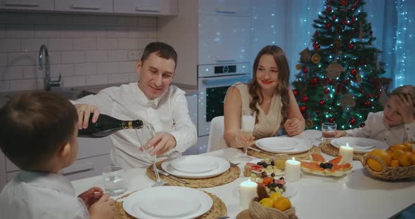 Happy Large Caucasian Family of Different Generations Celebrating Christmas at Home