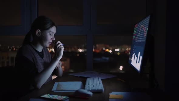 Portrait Woman of a Financial Analyst Working on Computer with Monitor Workstation with RealTime