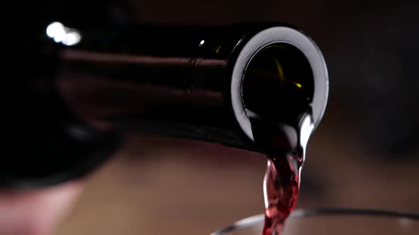 Red Wine Spilling From Bottle