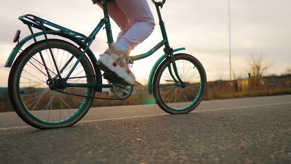 Close Up of Bike Wheels Driving on Road