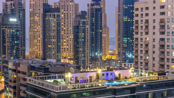 Aerial View of Dubai Marina After Sunset From a Vantage Point Day to Night Timelapse