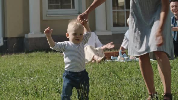 Happy Toddler Boy Learning to Walk