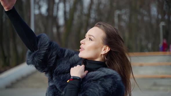 Beautiful woman doing selfie on her mobile phone. 