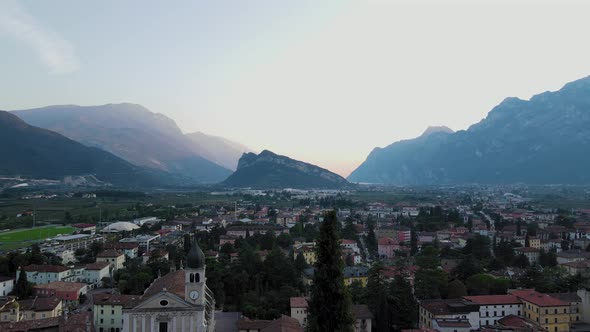 Aerial panoramic shot with fog and mountains on background. Countryside concept in Riva Del Garda (T