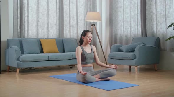 Asian Athletic Female Meditating During Workout On Yoga Mat At Home. Healthy Lifestyle, Fitness