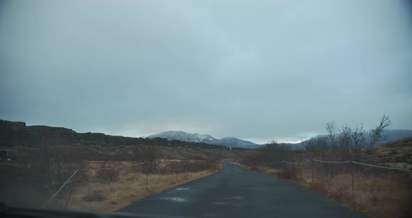 Travelling Along Empty Grey Road