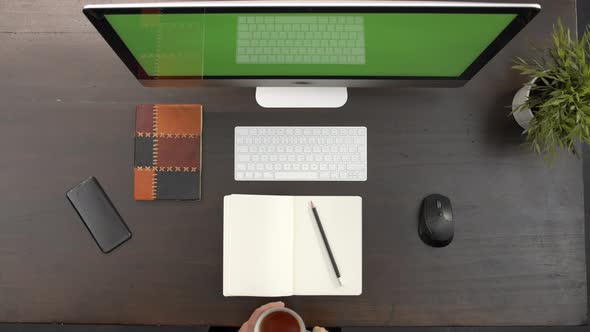 Overhead View of Woman Listening To Video Call Conference or Remote Education Class on Her Computer