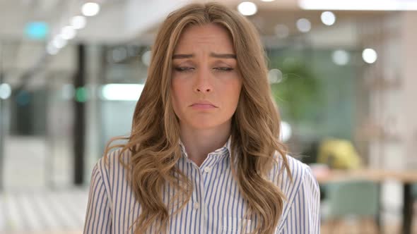 Portrait of Sad Businesswoman Crying at Camera 