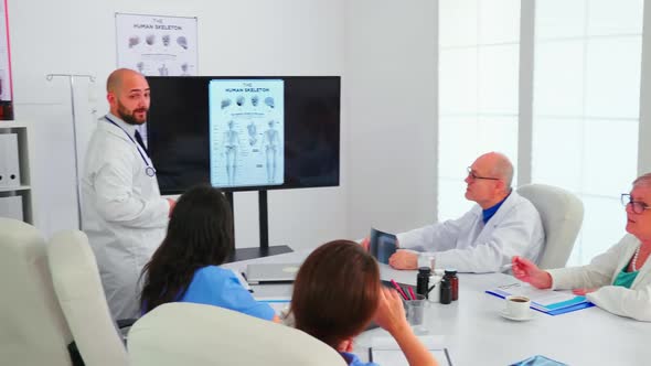 Medical Scientins Analysing Digital Human Skeleton Model