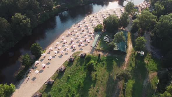 Aerial Top View of River Sand Beach with Lounges and Umbrellas