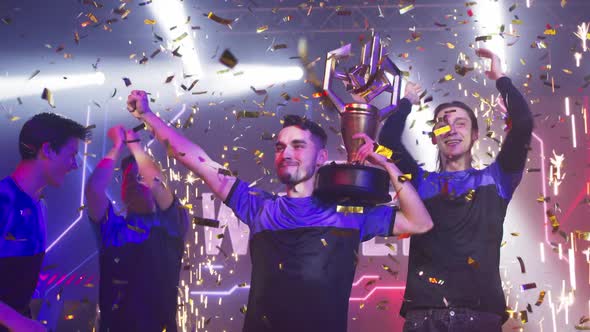 Team of Gamers Celebrating Victory in Professional Championship
