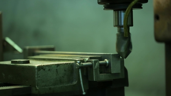 Process Of Grinding Metal Parts End Mill On a Horizontal Machine.