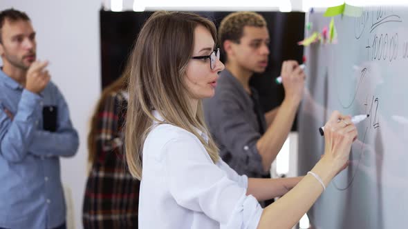 Diverse Group of Finance Office Worker Having Corporate Training and Using White Board