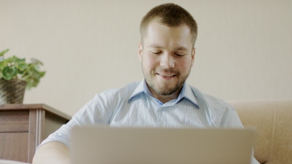 Man Chatting On a Laptop