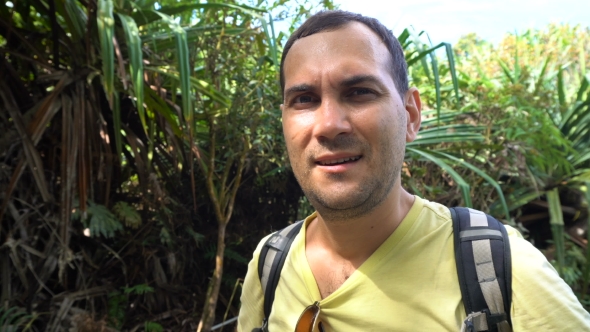 Male Portait. Young Man Breathe Heavily After Hiking