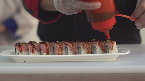 Chef Preparing Sushi in Japanese Restaurant