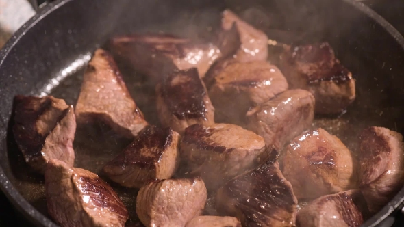 Frying Meat On Hot Pan