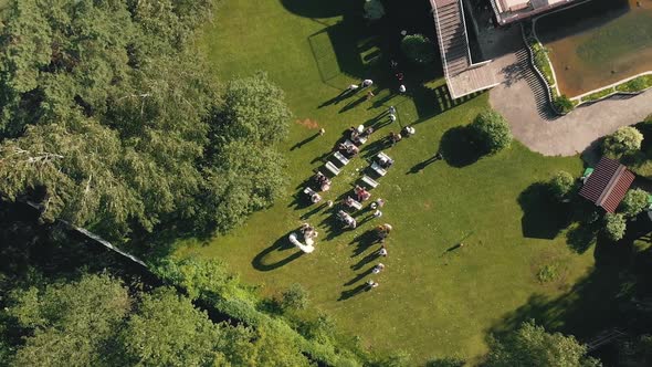 Wedding Ceremony with Arch and Chairs for the Guests Outdoor Aerial View