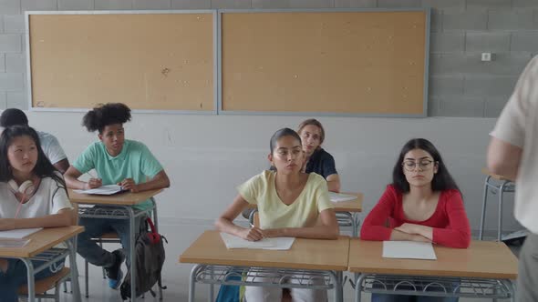 Male Teacher Speaking to Multiethnic Teenage Students in Class