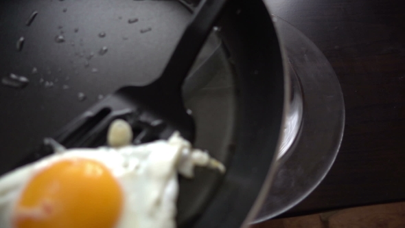 Preparing Scrambled Eggs On Hot Frying Pan