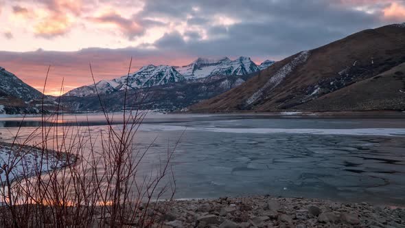 Time lapse moving on slider during colorful sunset over Deer Creek Reservoir