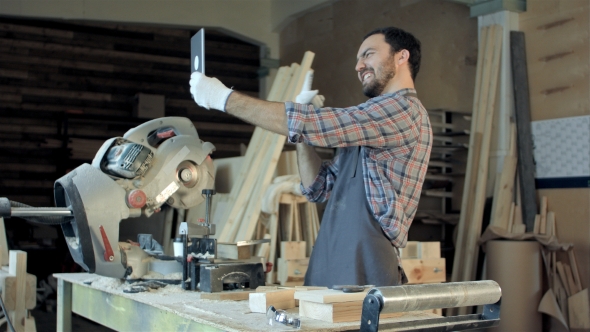 Carpenter Makes Selfie Near Woodworking Machines In Carpentry Shop.