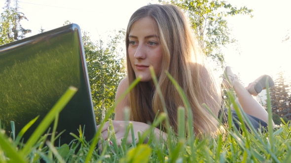 Young Girl With Laptop Working Outdoor