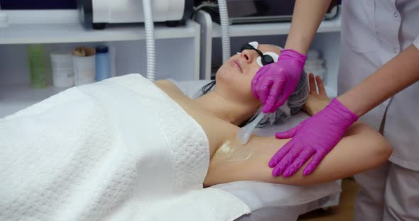 Applying Gel Under The Armpit Before Laser Hair Removal