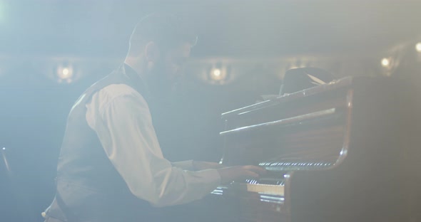 Man Playing Piano on the Stage