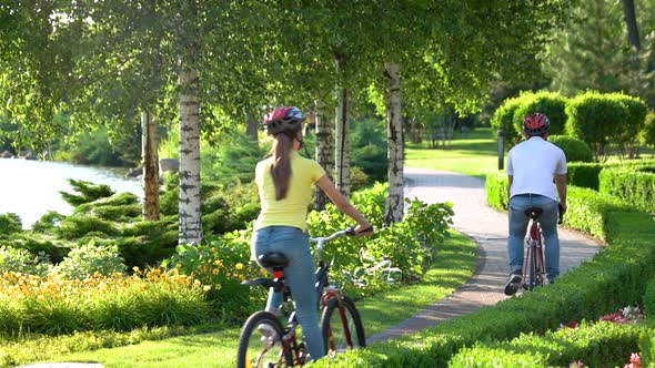 Young People Riding on Bicycles in Park