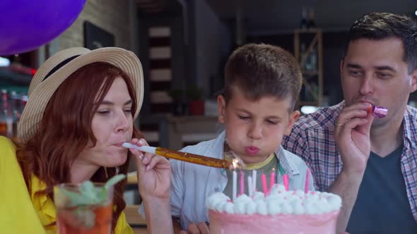 Cheerful Parents with Horns Celebrate Birthday with Their Son, Little Cute Boy Has Fun at Festive