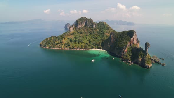 wide aerial panoramic around tropical Ko Kai Island in Krabi Thailand on a sunny summer day with a b